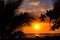 Sunset sky and sea landscape with wooden boats. Romantic seascape on tropical island. Orange sunset sky banner template