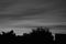 Sunset smokey black and white soft flowing clouds horizontal with footer text area