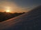 Sunset on a snowy alpine ridge