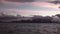 Sunset and snowy mountains view from ship of Falkland Islands Antarctica.