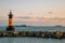 Sunset of Songdo beach, lighthouse and breakwater in Busan, Korea