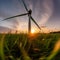 Sunset Spin: Wind Turbine in a Field of Green