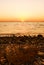 Sunset, stones and shoreline