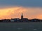 Sunset after a stormy day over a church on the seafront