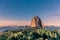 Sunset at Sugarloaf mountain with forests in foreground and mountains in background in Rio de Janeiro, Brazil, South America