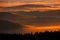 Sunset in Sumava mountain. Cold morning in Sumava National park, hills and villages in the fog and rime, misty view on czech lands