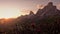 Sunset in summer on Passo di Giau with flowers on foreground, Dolomites, Italy