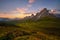 Sunset in summer on Passo di Giau with flowers on foreground, Dolomites, Italy