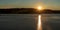 Sunset with sunlights above Vranovska prehrada lake in Czech republic