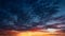 Sunset and sunrise sky. Orange, blue and yellow colors sunset. Panoramic view. Dramatic evening sky at sunset