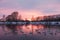 Sunset on the Svetloye lake, where wild whooper swans winter. Altai territory