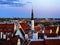 Sunset Tallinn old town red roofs medieval panorama  moon skyline  clouds blue sky sun down summer  weather Baltic sea on hor
