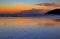 After Sunset tawny glow reflected in wet sand