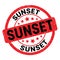 SUNSET text written on red-black stamp sign