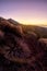 Sunset time in arid desertic vulcan mountain with colors and sky and high mount in background - climate change and warm effect