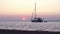 Sunset time-lapse & boat silhouette at Ria Formosa. Algarve. Portugal