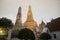 Sunset time at the main feature of Wat Arun Ratchawararam Ratworamahawihan Temple of Dawn .