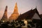 Sunset time at the main feature of Wat Arun Ratchawararam Ratworamahawihan Temple of Dawn .