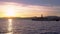 Sunset time and Port lighthouse in the mediterranean fishing village of Cambrils, Spain