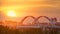 Sunset timelapse above the Bridge with the transport and clouds on the background. Central Asia, Kazakhstan, Astana