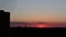 Sunset timelapse on an almost clear sky in the city of Munich, Germany. Silhouettes of houses, a church and a