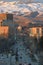 Sunset traffic on Capitol Boulevard downtown Boise Idaho, winter snow foothills background masthead text area vertical