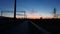 Sunset at the train stop with beautiful deep blue sky and red clouds. Wide