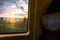 Sunset Through Train Window Passenger Seat Farmland Outdoors
