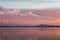 Sunset a Trasimeno lake Umbria, Italy, with fishing net poles and branches