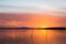 Sunset a Trasimeno lake Umbria, Italy, with poles on the foreground