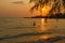 Sunset and traveler play water at beach