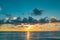 Sunset on tropical beach sea ocean with sunrise clouds. Banner for travel vacation. Cloudscape over the sea, sunrise