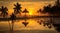 Sunset on tropical beach trees plant on sunset beach straw umbrellas tent on front sea water