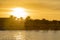 Sunset at a tropical resort. Creative sunset beach background with palm trees