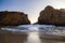 Sunset among two rocks at Pfeiffer State Park, Big Sur, Californ