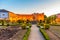 Sunset view of Archbishop palace viewed through gardens of Santa Barbara in Braga, Portugal