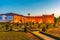 Sunset view of Archbishop palace viewed through gardens of Santa Barbara in Braga, Portugal