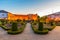 Sunset view of Archbishop palace viewed through gardens of Santa Barbara in Braga, Portugal