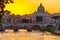 Sunset view of Basilica St Peter, bridge Sant Angelo and river Tiber in Rome