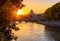 Sunset view of Basilica St Peter, bridge Sant Angelo and river Tiber in Rome