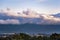 Sunset view of a blanket of clouds covering the forests of Santa Cruz Mountains, Stanford Dish visible in the foreground; San