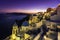 Sunset view of the blue dome churches of Santorini