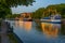 Sunset view of boats mooring alongside river Aura in Turku, Finl