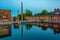 Sunset view of brick buildings alongside Tammerkoski channel in