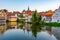 Sunset view of cityscape of German city Bamberg reflecting on ri