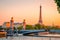 Sunset view of  Eiffel Tower, Alexander III Bridge and river Seine in Paris, France