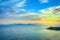 Sunset view of Elba Island and Piombino piazza bovio lighthouse.