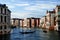 Sunset view with a gondola over the channel in Venice