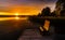 Sunset view of Jezioro Selmet Wielki lake landscape with recreation pier in Sedki village in Masuria region of Poland