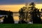 Sunset view of Jezioro Selmet Wielki lake landscape with vintage pier, reeds and shoreline in Sedki in Masuria region of Poland